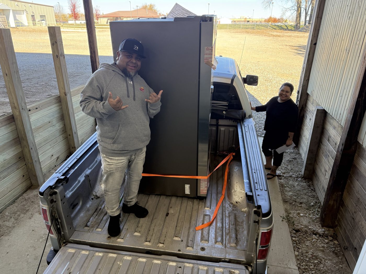 A new refrigerator with a small cosmetic mark on its side panel
